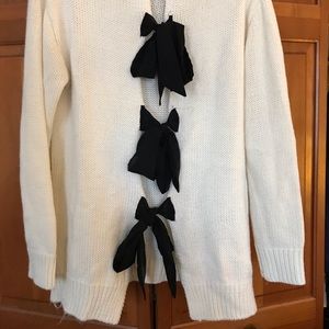 Turtleneck sweater with bow detail